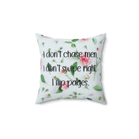 A 14 inch pillow featuring an all-over image featuring a small print composition of pink roses, green leaves, and small green buds scattered on a white background. Overlaid in bold, black handwritten-style text is the phrase: "I don’t chase men. I don’t swipe right. I flip pages." The small print floral background gives the image a soft, romantic feel, while the text adds a sassy and book-lover-friendly attitude.